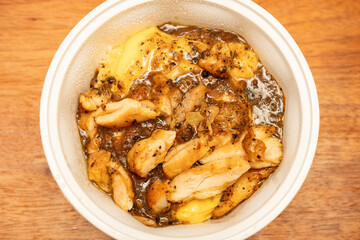 top view grilled chicken in black pepper sauce with fluffy eggs over rice