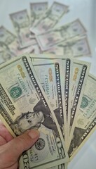 American or US dollars in form of a bunch of fifty and twenty dollar bills - money in the USA