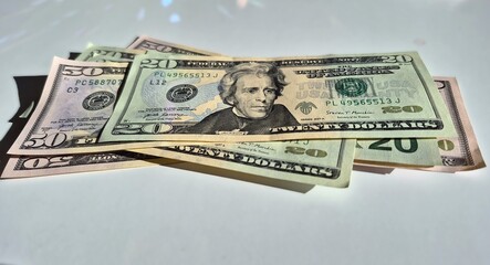 American or US dollars in form of a bunch of fifty and twenty dollar bills - money in the USA