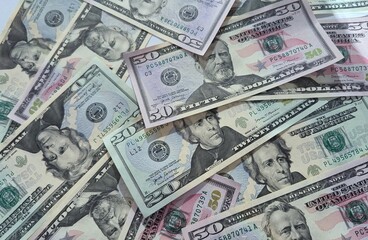 American or US dollars in form of a bunch of fifty and twenty dollar bills - money in the USA