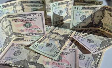 American or US dollars in form of a bunch of fifty and twenty dollar bills - money in the USA