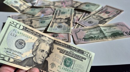 American or US dollars in form of a bunch of fifty and twenty dollar bills - money in the USA