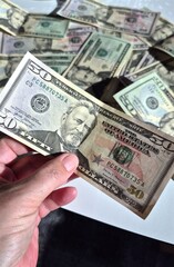 American or US dollars in form of a bunch of fifty and twenty dollar bills - money in the USA