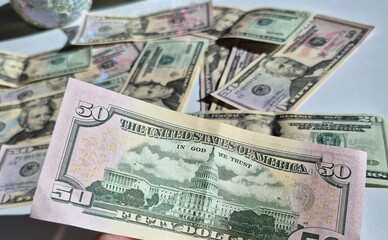 American or US dollars in form of a bunch of fifty and twenty dollar bills - money in the USA