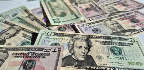 American or US dollars in form of a bunch of fifty and twenty dollar bills - money in the USA
