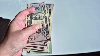 American or US dollars in form of a bunch of fifty and twenty dollar bills - money in the USA