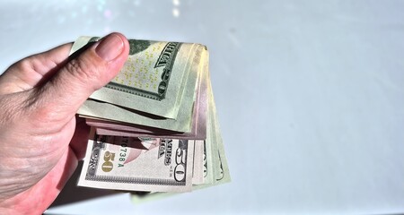 American or US dollars in form of a bunch of fifty and twenty dollar bills - money in the USA