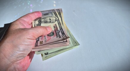 American or US dollars in form of a bunch of fifty and twenty dollar bills - money in the USA