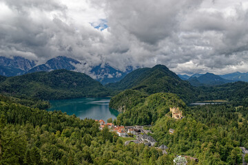 Fototapeta premium A cloudy autumn day near a castle at the foot of the Alps.