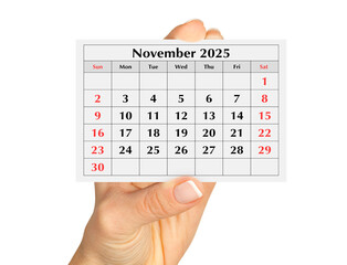 Page of the annual monthly calendar november 2025 in hand. Isolated on transparent png