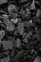 Pile of Dark Wood Charcoal Pieces