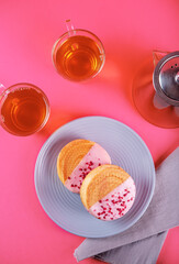 Berry croissant rolls on a pink background