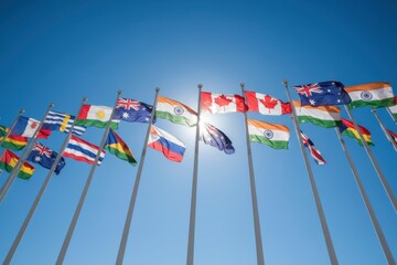 Flags of various nations waving in the wind against a clear blue sky, symbolizing unity, diversity, and international cooperation in a vibrant global landscape