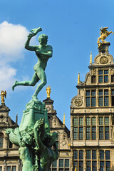 Fototapeta premium statue of Silvius Brabo, a legendary Roman soldier and building are located in the historic Grote Markt, the central square of Antwerp, surrounded by guild houses and major landmarks. 
