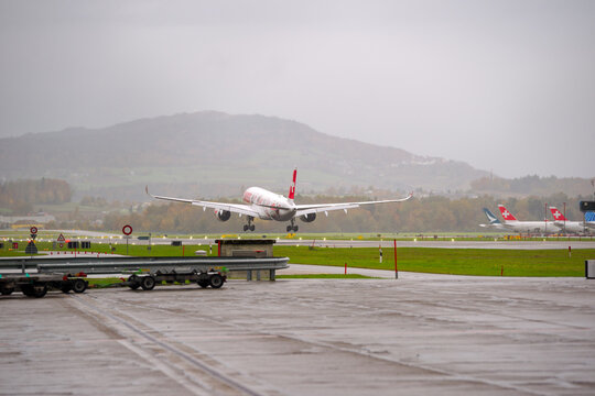 Swiss passenger airplane Airbus A350-900 registration HB-IFA landing at Swiss Zurich Airport after a go-around on a cloudy windy autumn day. Photo taken October 25th, 2025, Zurich Kloten, Switzerland.