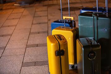A collection of luggage on a city street.