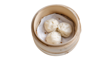 Soft steamed buns served in a bamboo steamer basket on transparent background, concept of Asian cuisine, traditional food and dim sum culture