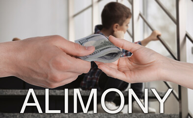 Father giving money to his ex-wife near their son indoors. Financial support for child after...