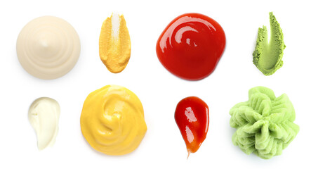 Mustard, mayonnaise, wasabi and ketchup on white background, set. Top view