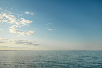 Blue Skies at Sunset with Clouds by the Beach 