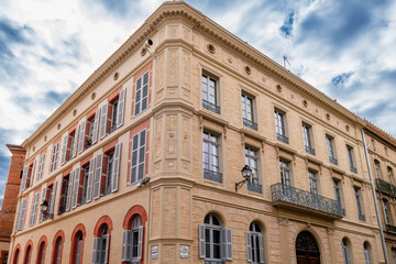 Facades of a building in Place Saint Sernin in the city center of Toulouse, in Occitania, France.
