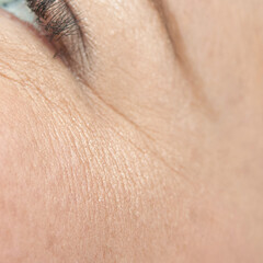 Fototapeta premium Close-up of mature caucasian female eye and delicate skin texture.