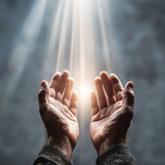 Hands reaching upward with light beams shining down, symbolizing hope and optimism