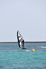 kitesurfer surfing on Atlantic ocean in Corralejo, Fuerteventura, Canary islands, Spain