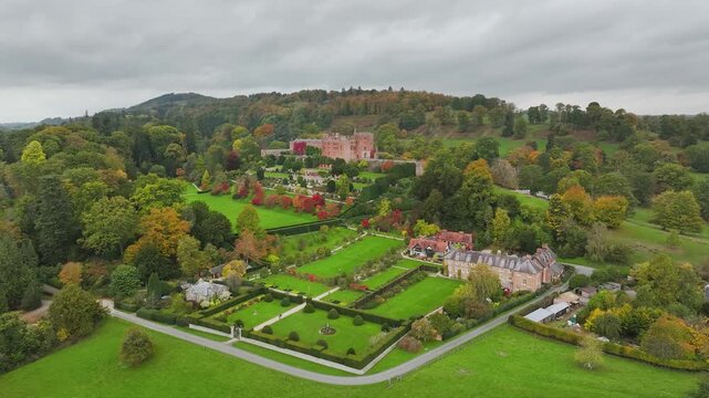 Autumn colours over Powis Castle and Garden from drone, Welshpool, Powys, Wales, England
