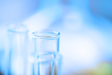Chemical test tubes on a blue blurred background