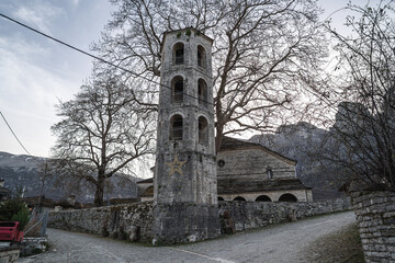 Stone Bell Tower in Church Courtyard with Mountain View in Papingo, Greece