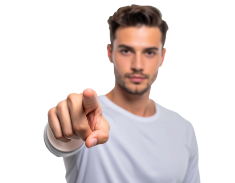 Brunette man in white shirt pointing forward, isolated against a black backdrop. Blurred background