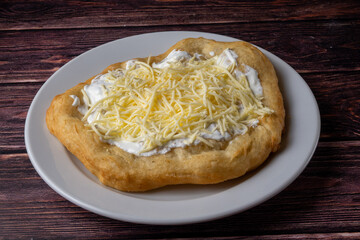 Hungarian traditional fast food - deep fried flatbread, lángos