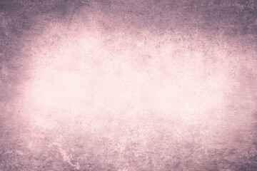Softly lit textured background with subtle pink and purple hues