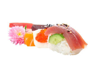 Close-up of colorful sushi arrangement with pink flower on a black background