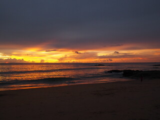 Scenic view of Phuket beach during golden hour with vibrant sunset colors over the ocean. Captures Thailand&rsquo;s tropical coastline, warm sunlight, and tranquil seascape