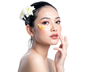 Asian woman with flowers in hair and on face, posing with soft light, against a dark, transparent background