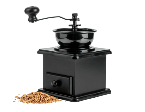 Classic black coffee grinder with a crank handle beside a pile of coffee beans against a dark background
