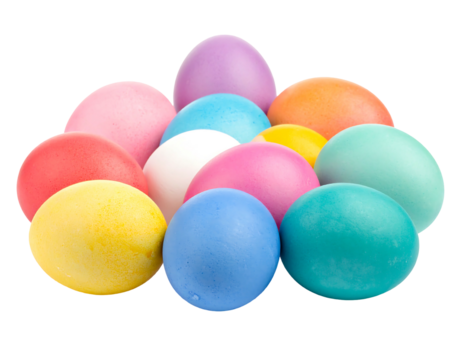 Close-up shot of colorful Easter eggs arranged in a cluster on a black background in soft focus