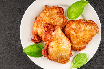 Chicken thighs fried poultry meat dish natural product tasty snack fresh delicious gourmet food background on the table rustic top view copy space