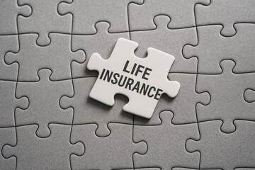 Obraz premium Life Insurance Concept Represented by Puzzle Piece on Gray Background in Insurance Theme Image
