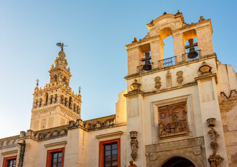 Puerta del Perdon gate and Giralda tower of Seville cathedral, Spain