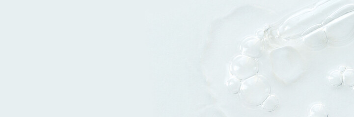 Clear gel bubbles on white background with textured surface.