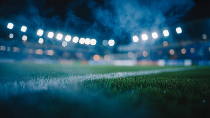 Empty soccer stadium at night with bright lights and fog 