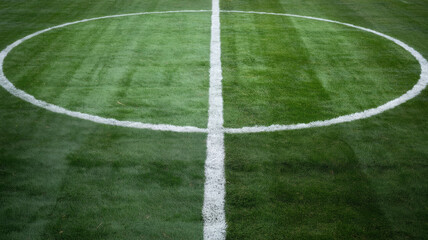 Soccer field markings with center circle and halfway line 