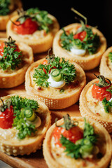 Mini vegetable tartlets with herbs close-up