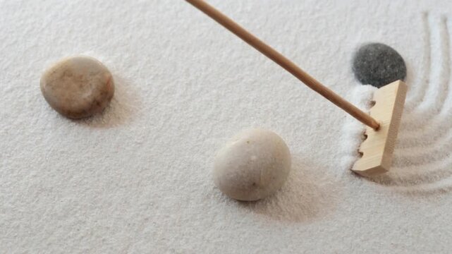 Making zen garden from white sand and stones