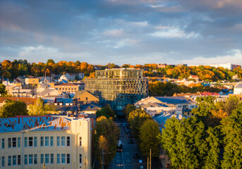 Kaunas old town and modern new city center in autumn, Lithuania. Aerial drone view on golden hour