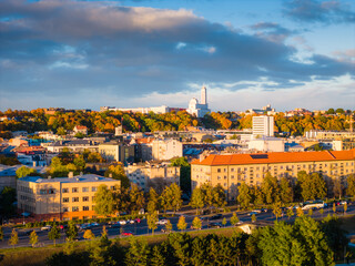 Kaunas old town and modern new city center in autumn, Lithuania. Aerial drone view on golden hour