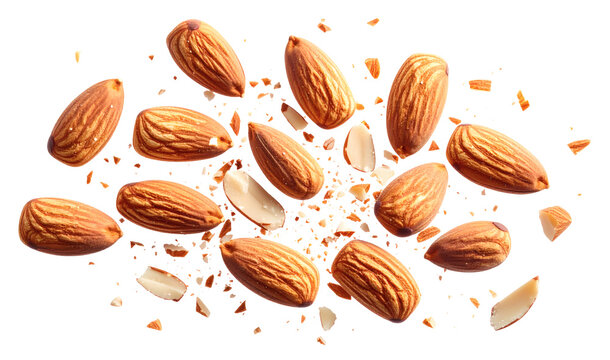 Top view of whole almonds and broken pieces in mid-air, with tiny crumbs scattered around